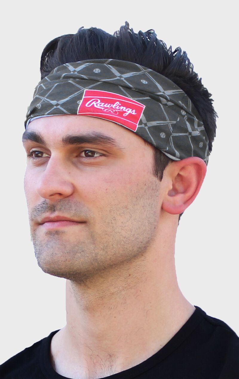 A guy wearing a graphite Rawlings multi-purpose neck gaiter as a head band - SKU: RC40005-005