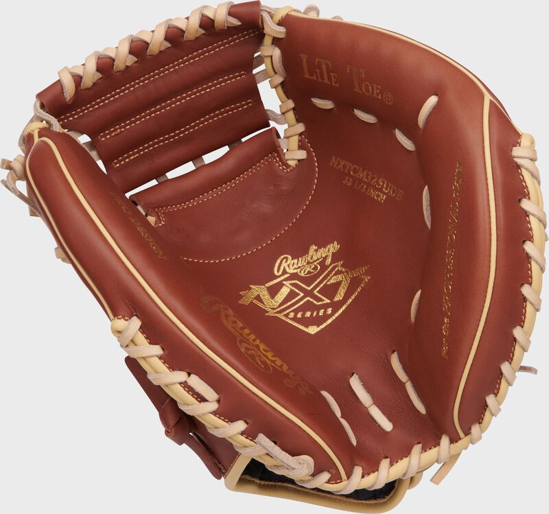 Dark brown palm of a Rawlings NXT Series catcher's mitt with gold stamping and tan laces