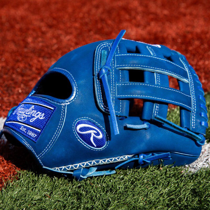 Thumb of a blue ColorSync 8.0 Heart of the Hide 12.25" glove on a field