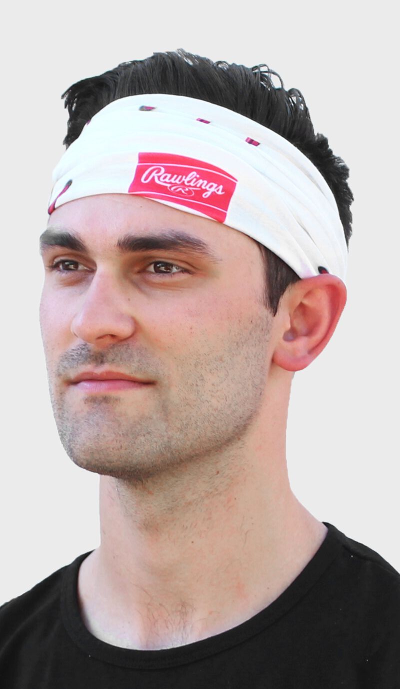 A guy wearing a white baseball stitch multi-functional neck gaiter as a head band - SKU: RC40001-100