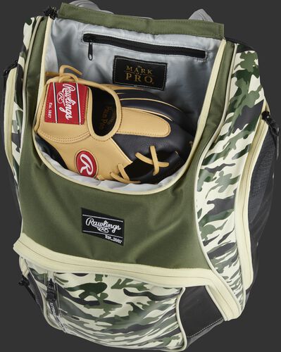 A glove in the dedicated glove storage pocket of a Rawlings Legion equipment backpack - SKU: LEGION-CAMO