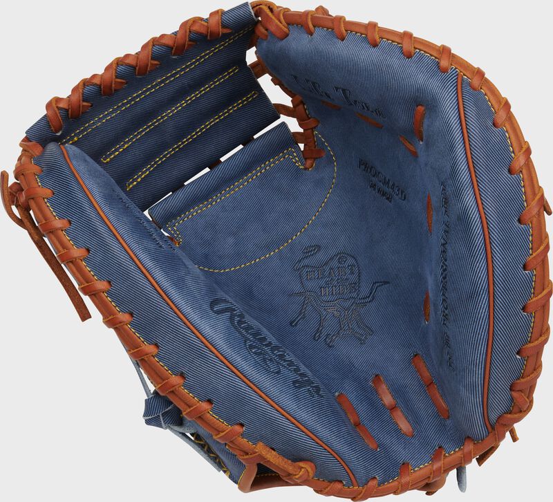 Palm of a Rawlings Heart of the Hide Pro Label Denim catcher's mitt with tan laces