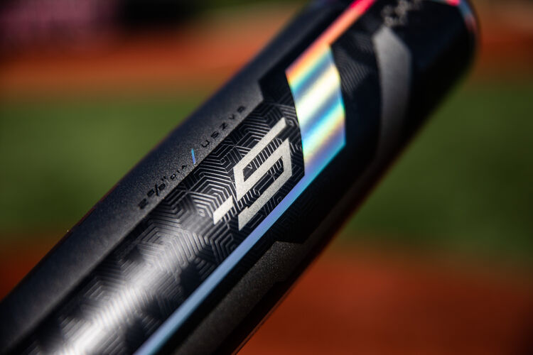 Barrel of a -5 Rawlings Velo ACP USA bat with a field in the background - SKU: USZV5