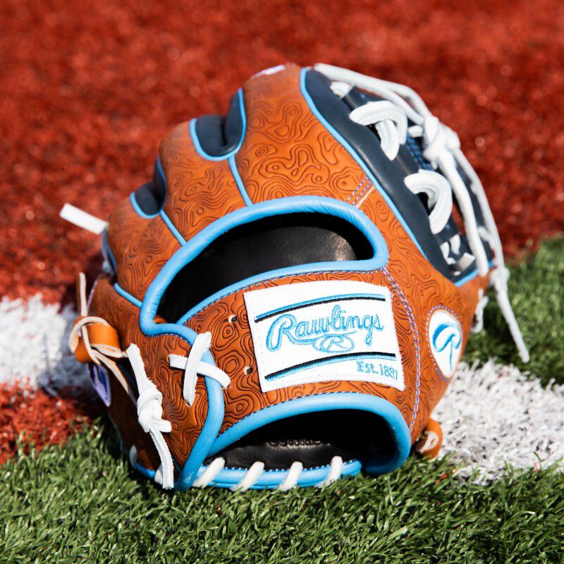 Wrist and patch on a Rawlings HOH ColorSync 8.0 infield glove on a field