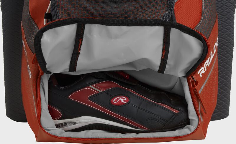 An orange Rawlings baseball backpack with a cleat in the bottom cleat storage compartment - SKU: IMPLSE-BO