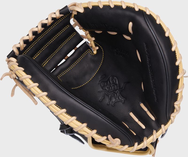 Black palm of a Rawlings Heart of the Hide Adley Rutschman catcher's mitt with camel laces