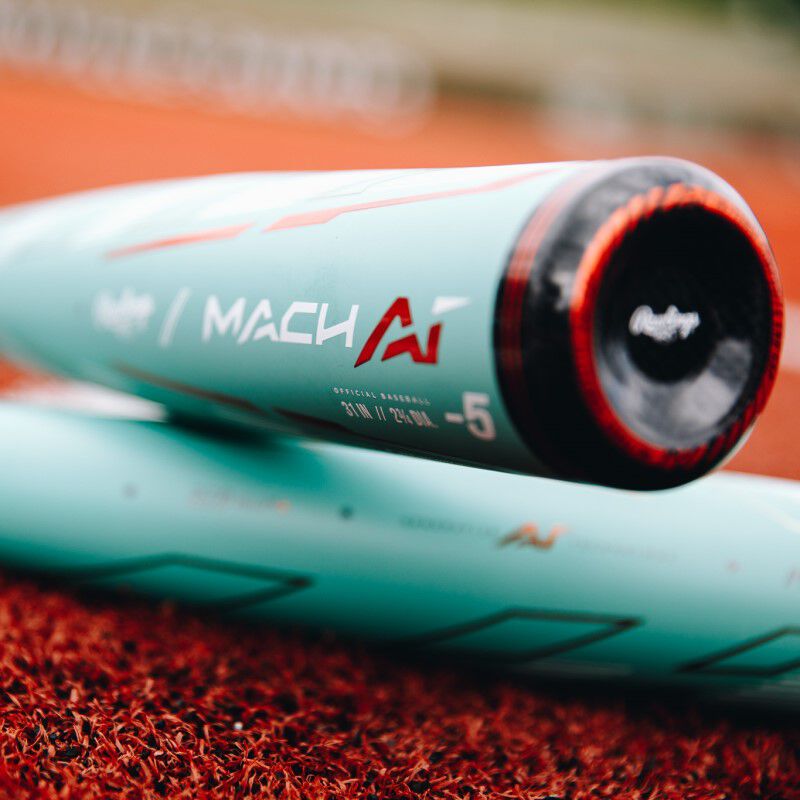 An ocean mint USSSA -5 baseball bat leaning on top of another bat - SKU: RUT4MC